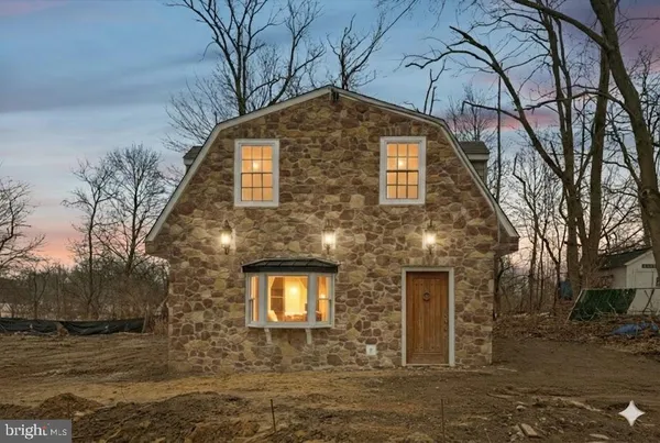 a front view of a house with yard