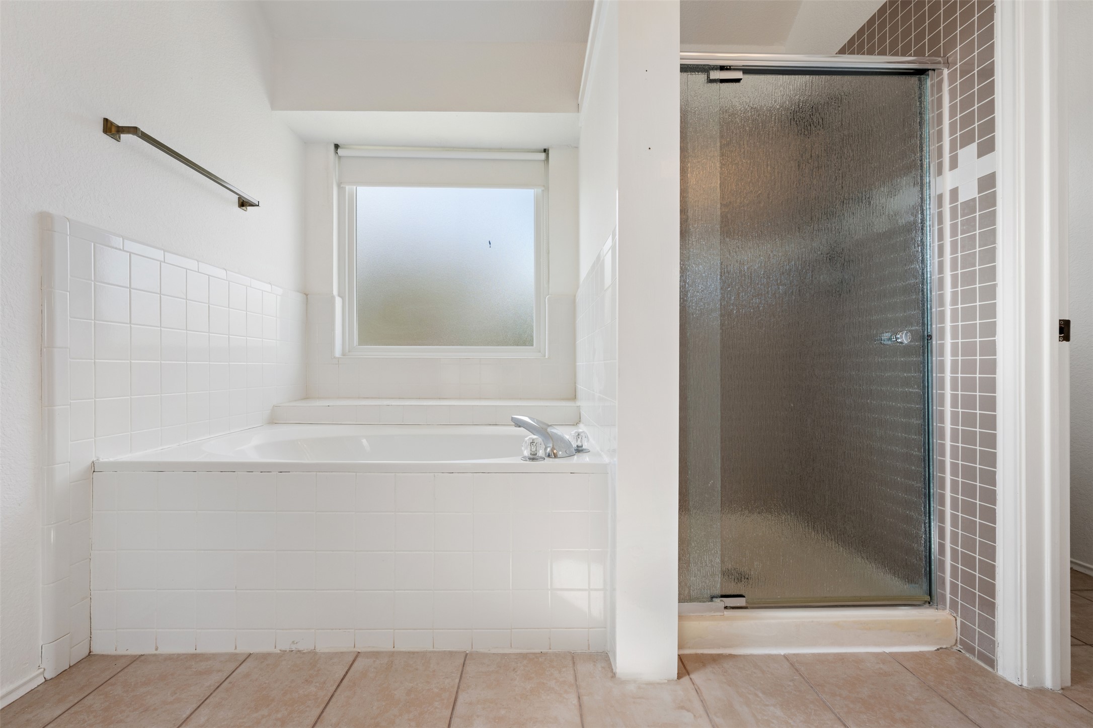 104 Sunset Road Georgetown, TX 78633 - Photo 29 of 40 Full bathroom featuring a garden tub, a shower stall, and light tile patterned floors