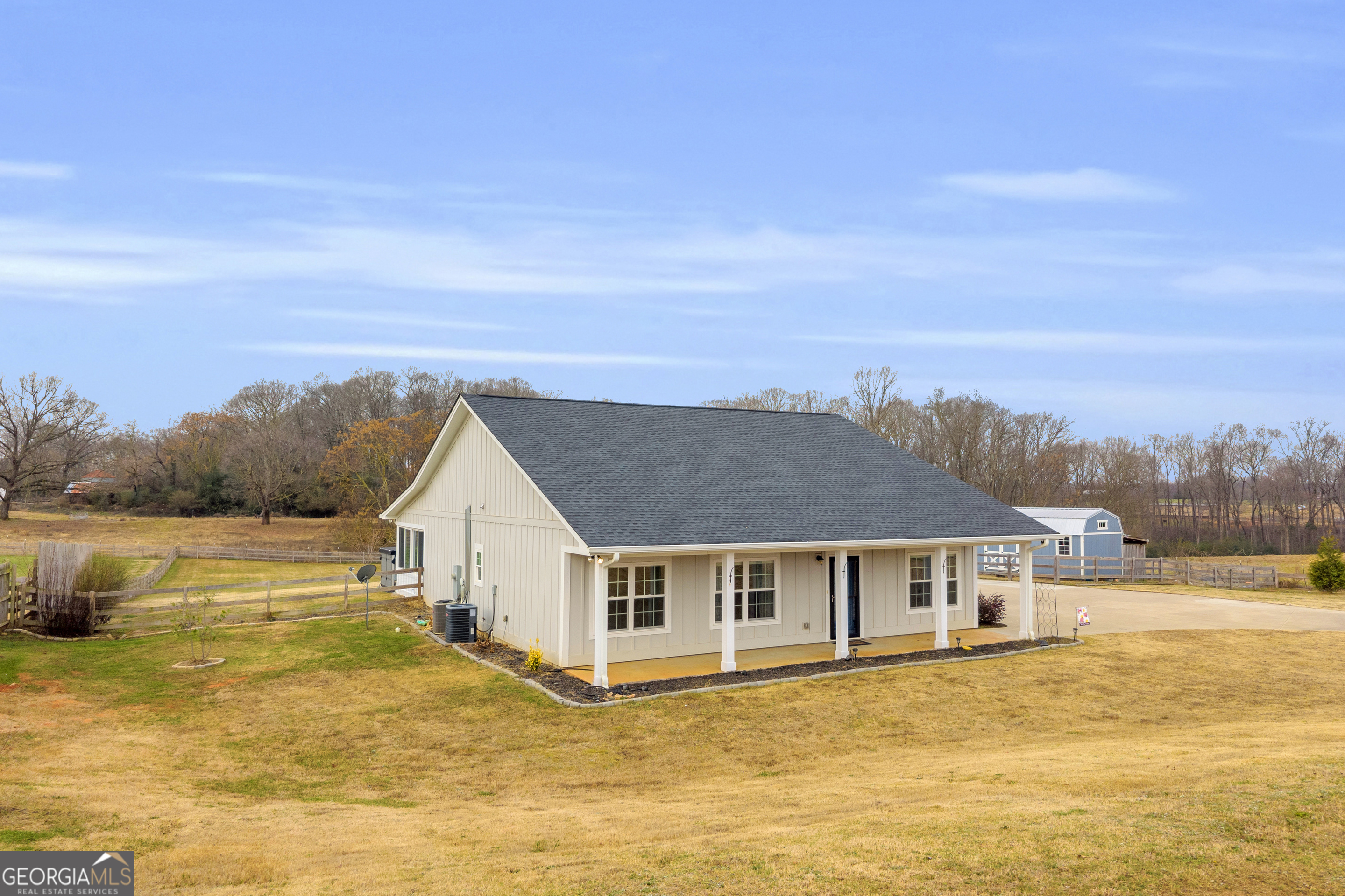 5177 Sandy Cross Road Carnesville, GA 30521 - Photo 12 of 86 a view of a house next to a lake with a city
