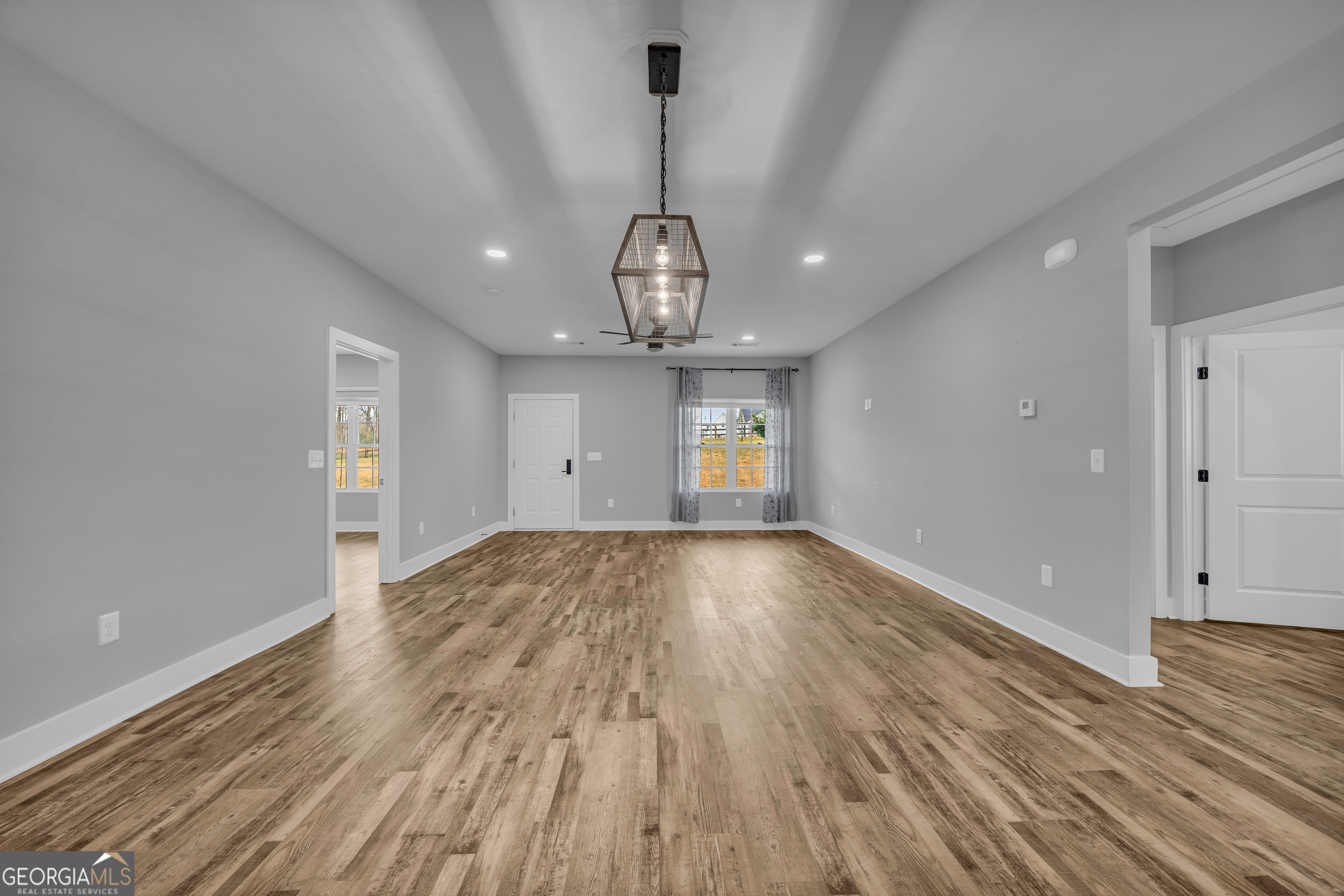 5177 Sandy Cross Road Carnesville, GA 30521 - Photo 35 of 86 wooden floor in an empty room with a window