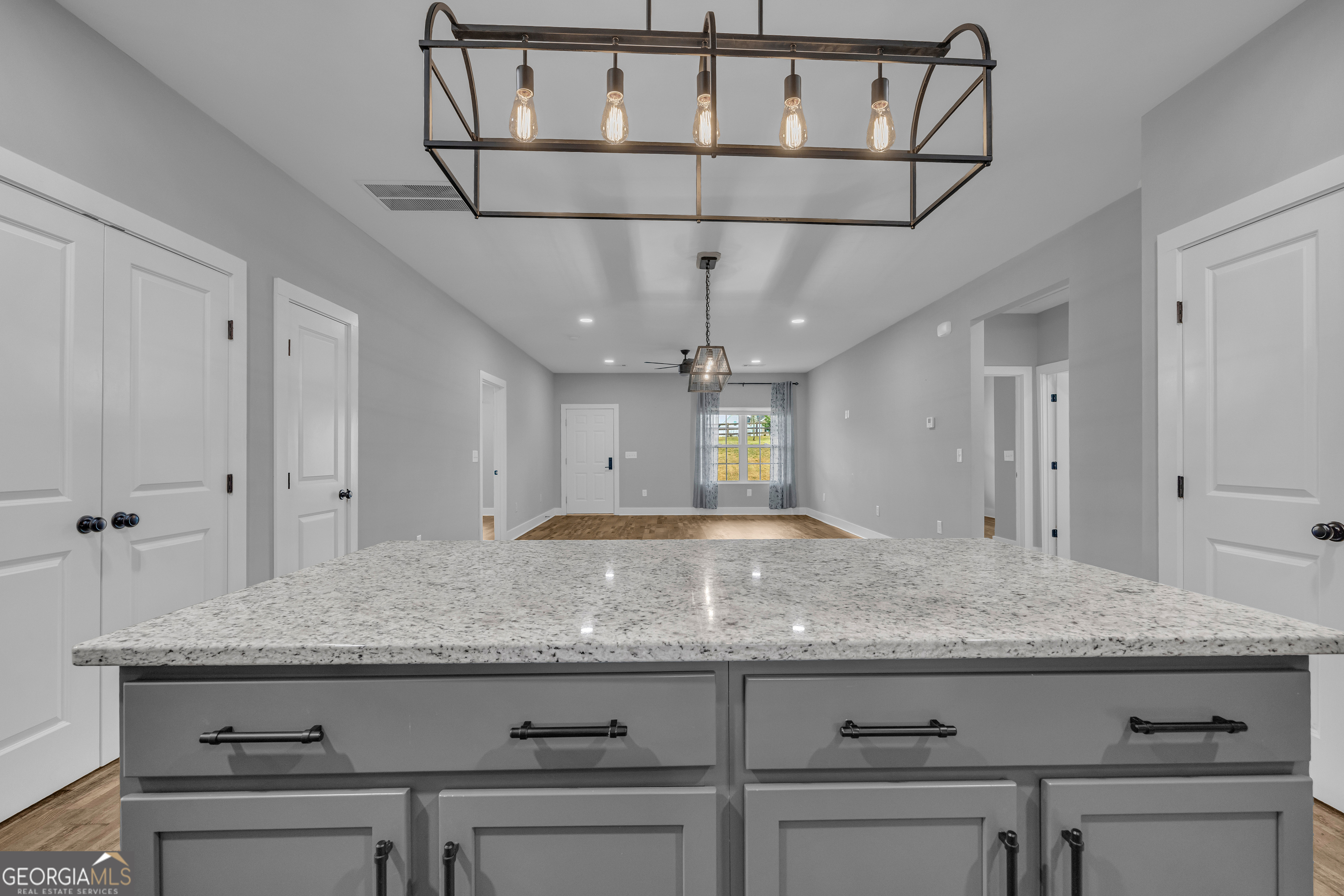5177 Sandy Cross Road Carnesville, GA 30521 - Photo 44 of 86 a view of granite countertop kitchen island with stainless steel appliances granite countertop living room