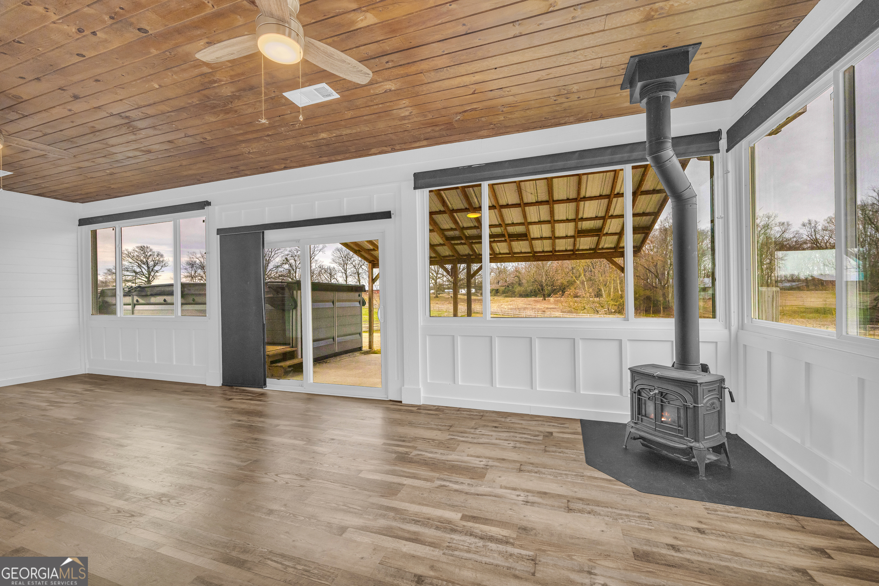 5177 Sandy Cross Road Carnesville, GA 30521 - Photo 49 of 86 a view of an empty room with wooden floor and a window