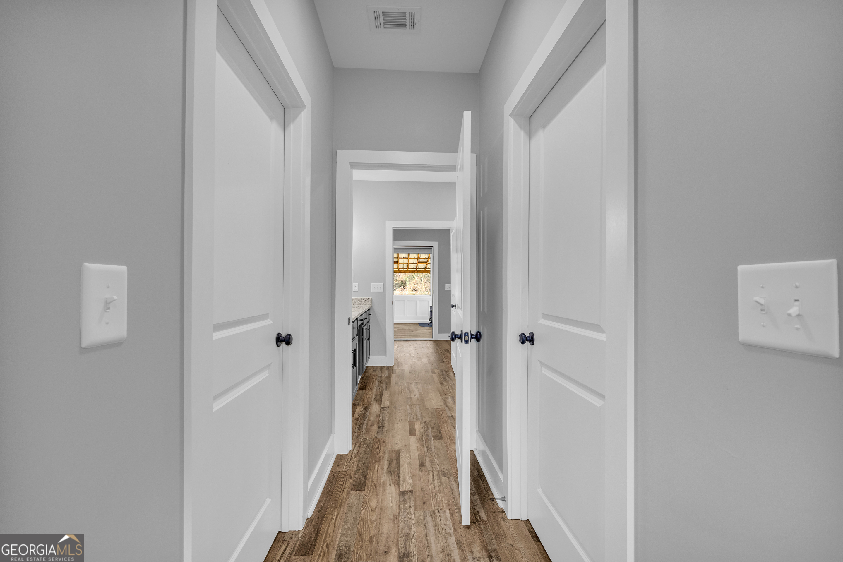 5177 Sandy Cross Road Carnesville, GA 30521 - Photo 62 of 86 a view of a hallway with a wooden floor