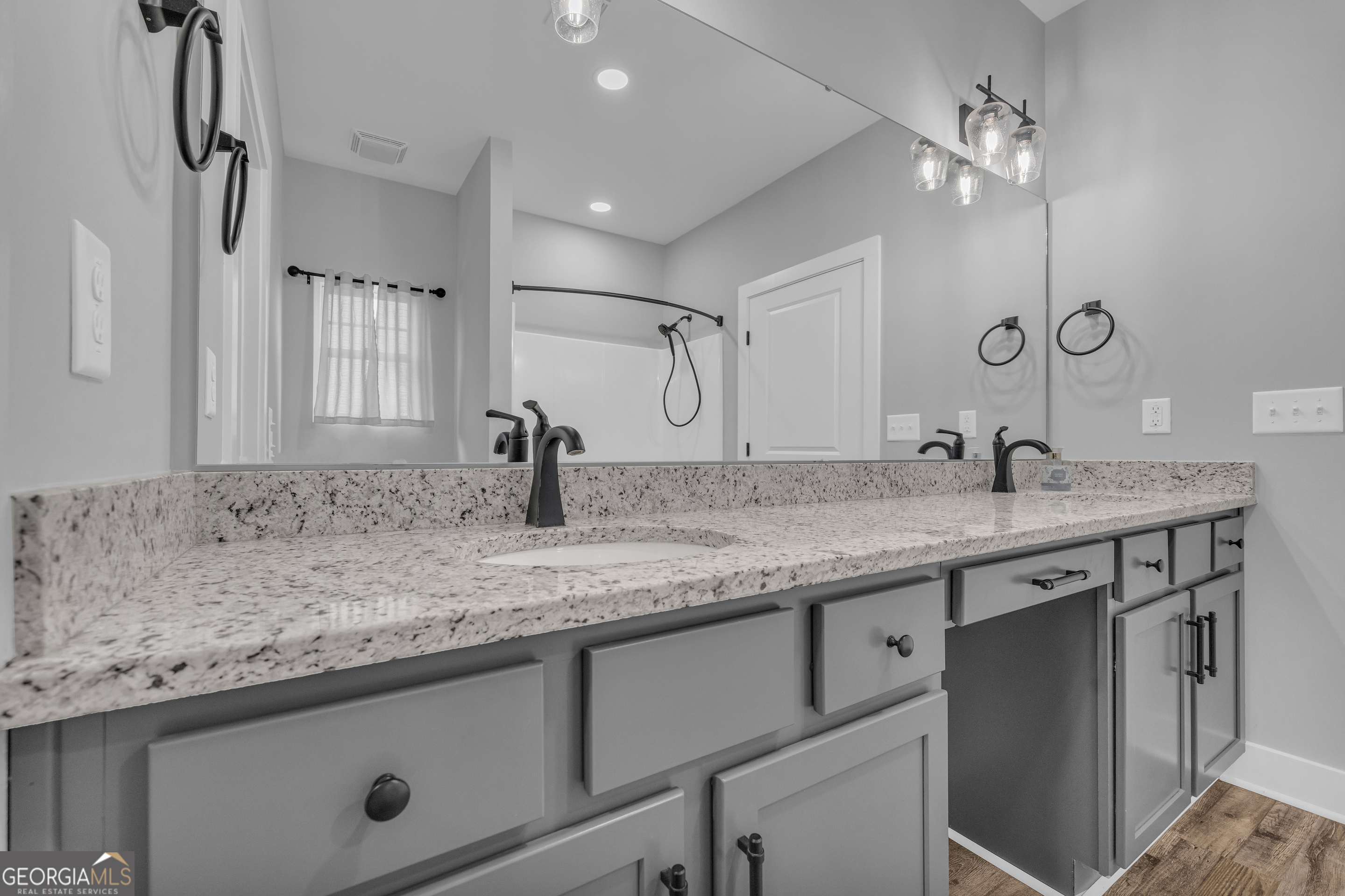 5177 Sandy Cross Road Carnesville, GA 30521 - Photo 67 of 86 a bathroom with a granite countertop sink and a mirror