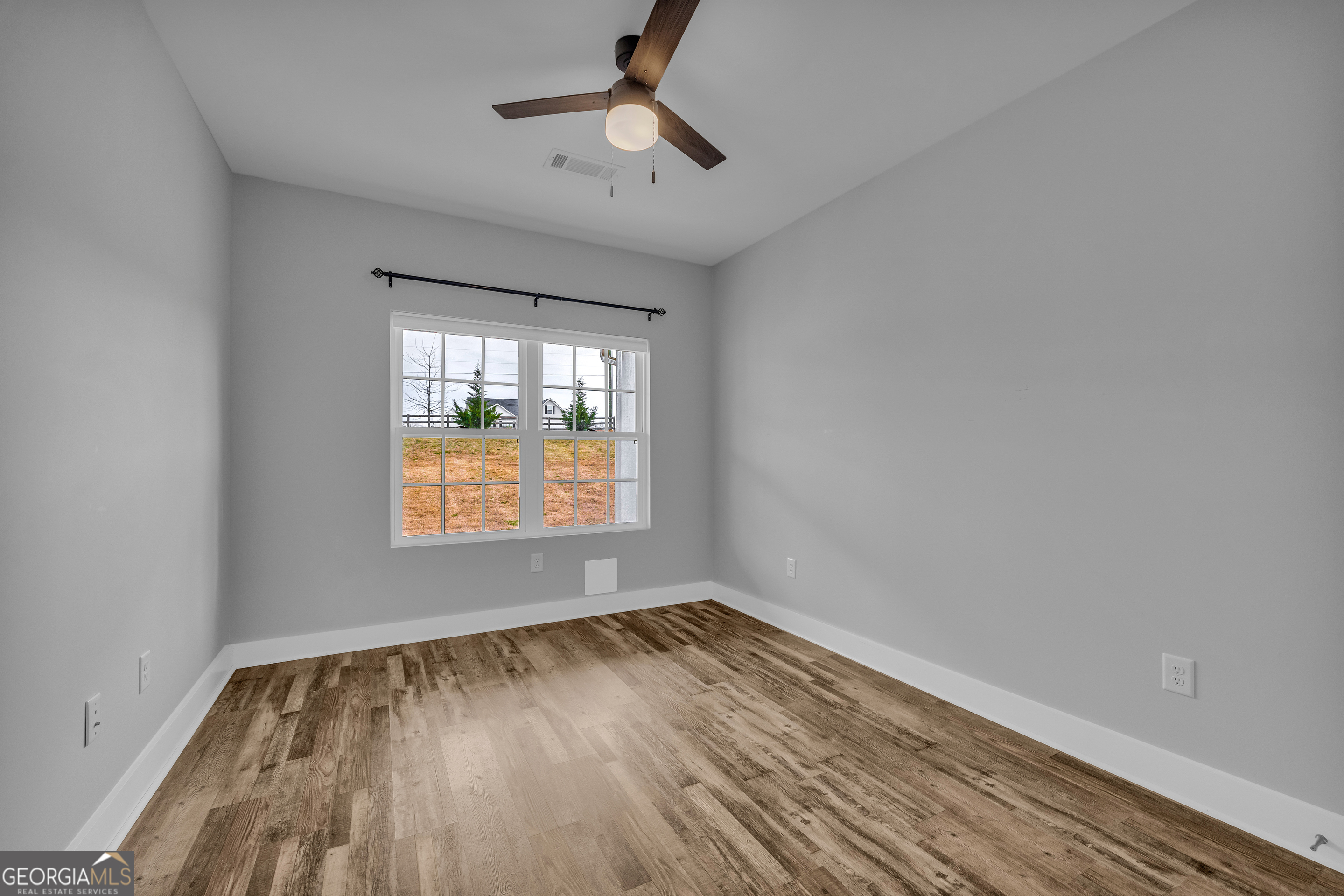 5177 Sandy Cross Road Carnesville, GA 30521 - Photo 71 of 86 wooden floor in an empty room with a window