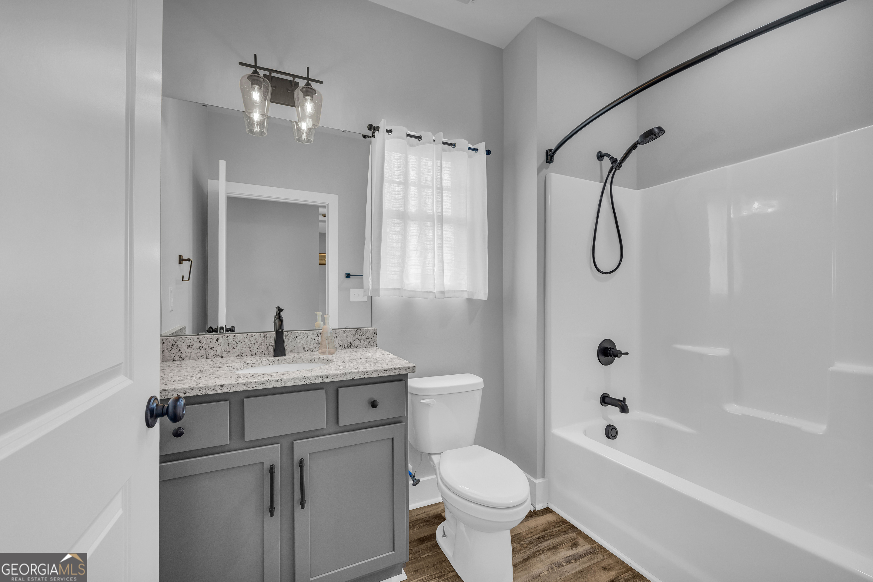 5177 Sandy Cross Road Carnesville, GA 30521 - Photo 73 of 86 a bathroom with a sink toilet a shower and a bathtub