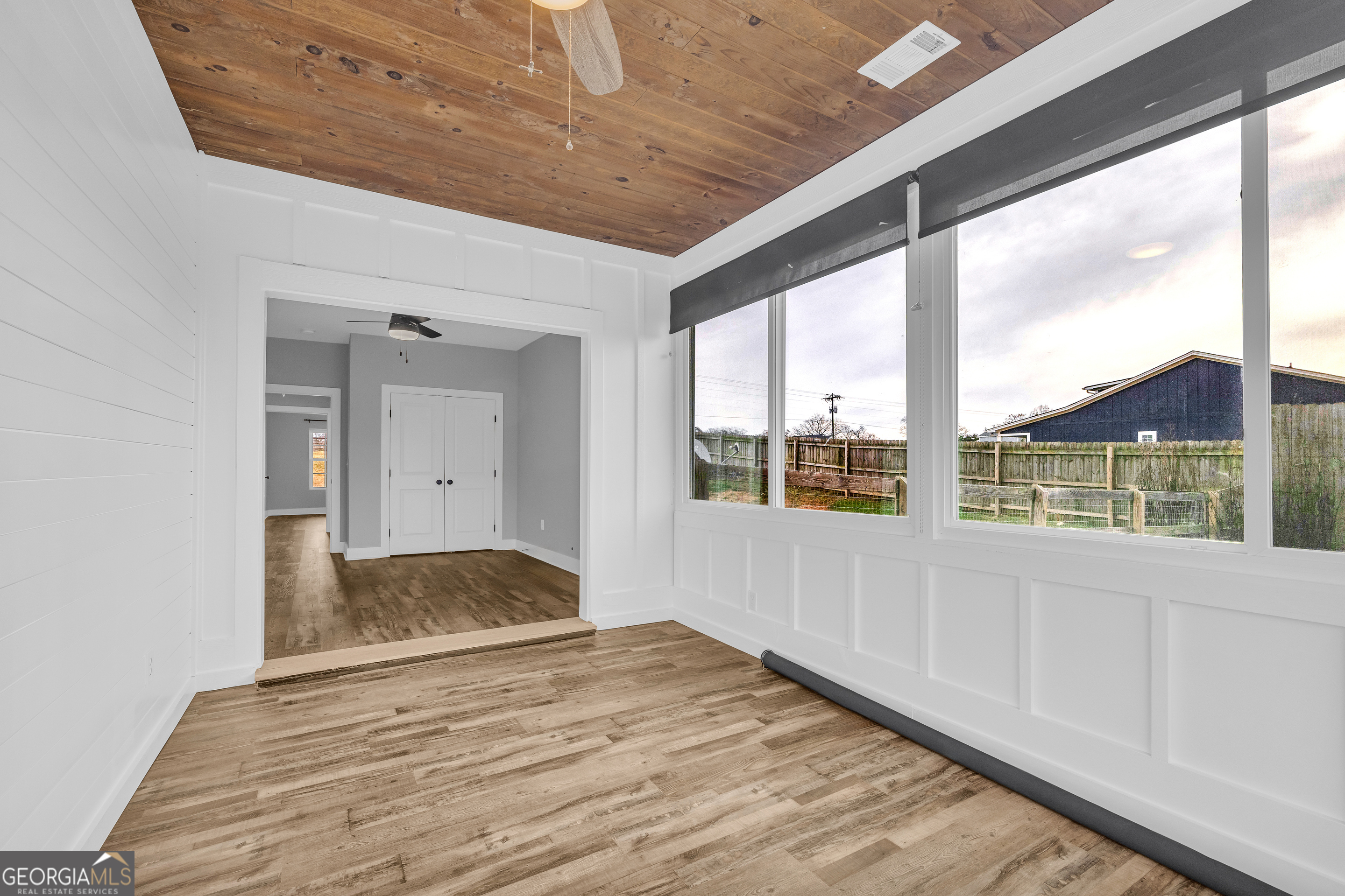5177 Sandy Cross Road Carnesville, GA 30521 - Photo 77 of 86 a view of empty room with wooden floor and fan