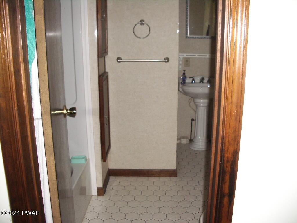 81 Tuthill Road Waymart, PA 18472 - Photo 17 of 29 a bathroom with a granite countertop shower