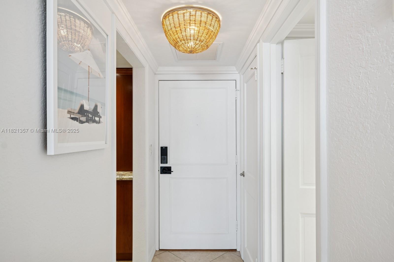 2899 Collins Avenue, Unit 1025 Miami Beach, FL 33140 - Photo 11 of 19 a view of a hallway with wooden floor