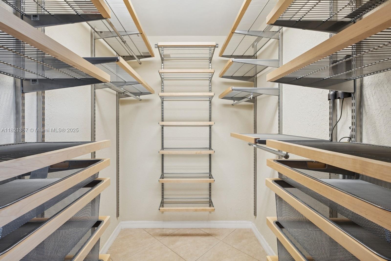 2899 Collins Avenue, Unit 1025 Miami Beach, FL 33140 - Photo 13 of 19 a view of walk in closet with empty racks