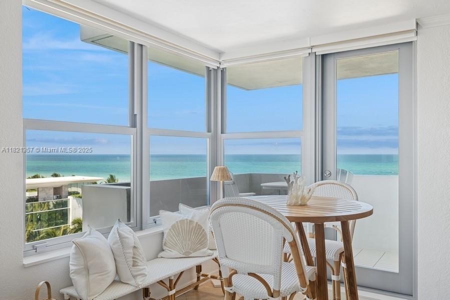 2899 Collins Avenue, Unit 1025 Miami Beach, FL 33140 - Photo 2 of 19 a dining room with furniture and window