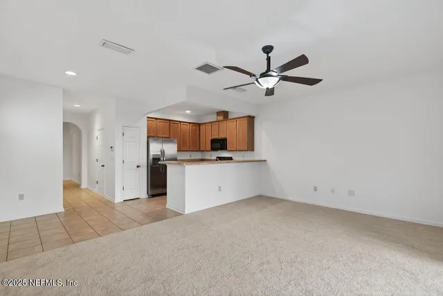 a view of a kitchen with a sink and cabinet