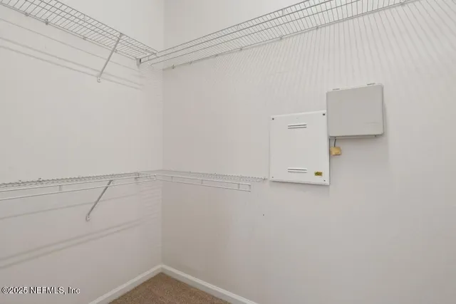 a view of a room with racks on the wall