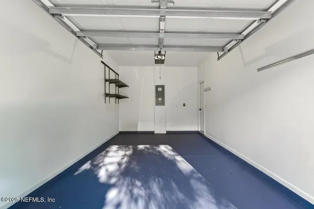a view of porch with a floor to ceiling window and wooden fence