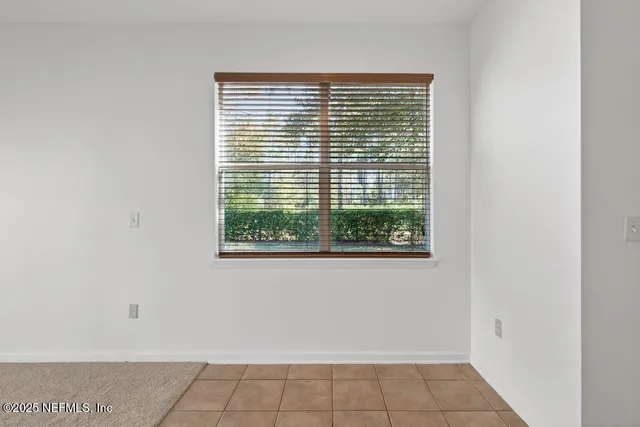 a view of a room that has a window in it