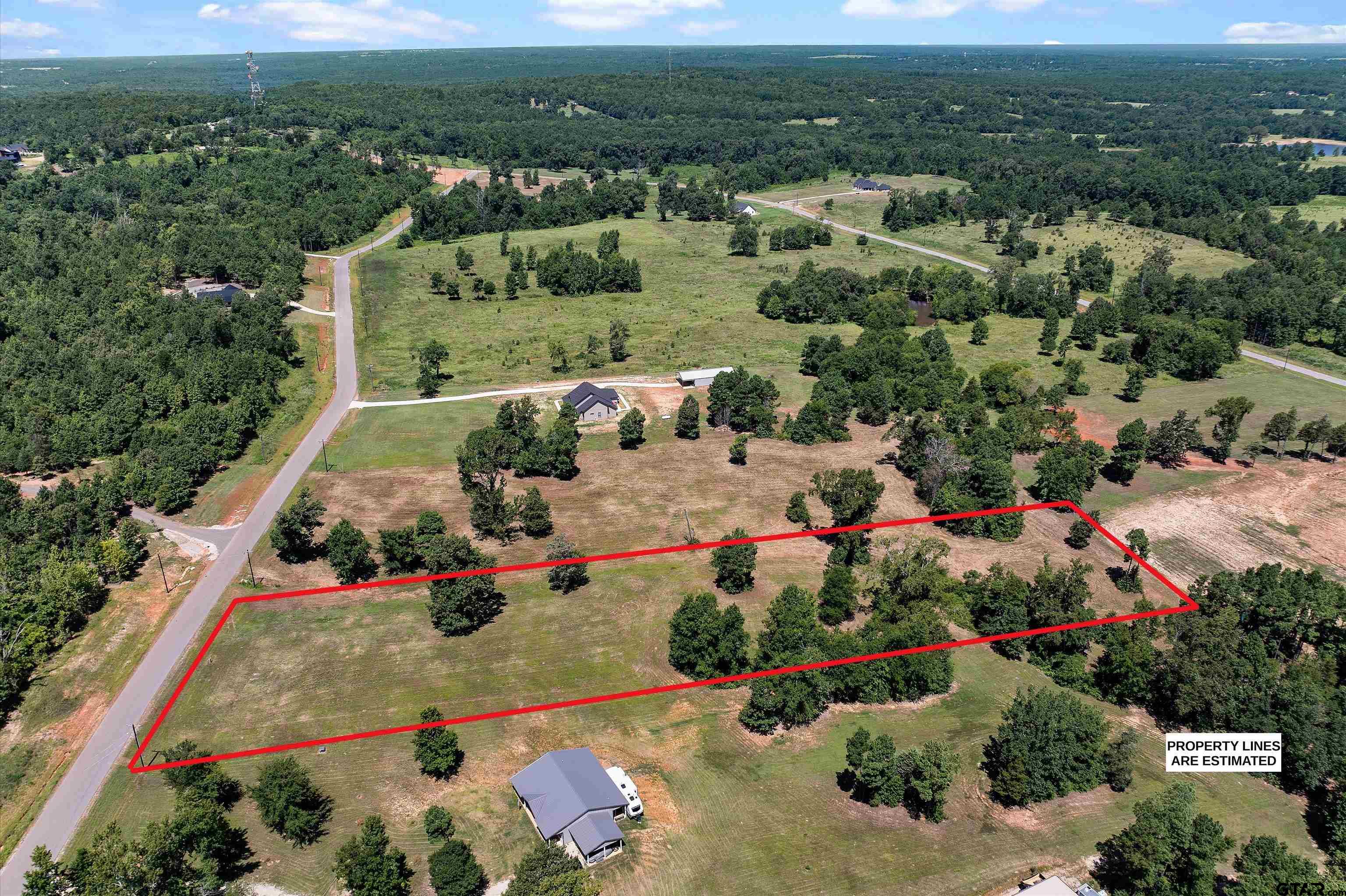 16864 Ridgeline Loop Winona, TX 75792 - Photo 6 of 9 an aerial view of residential houses with outdoor space