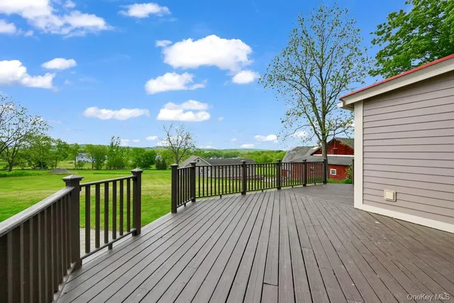 a view of a livingroom with furniture and a window