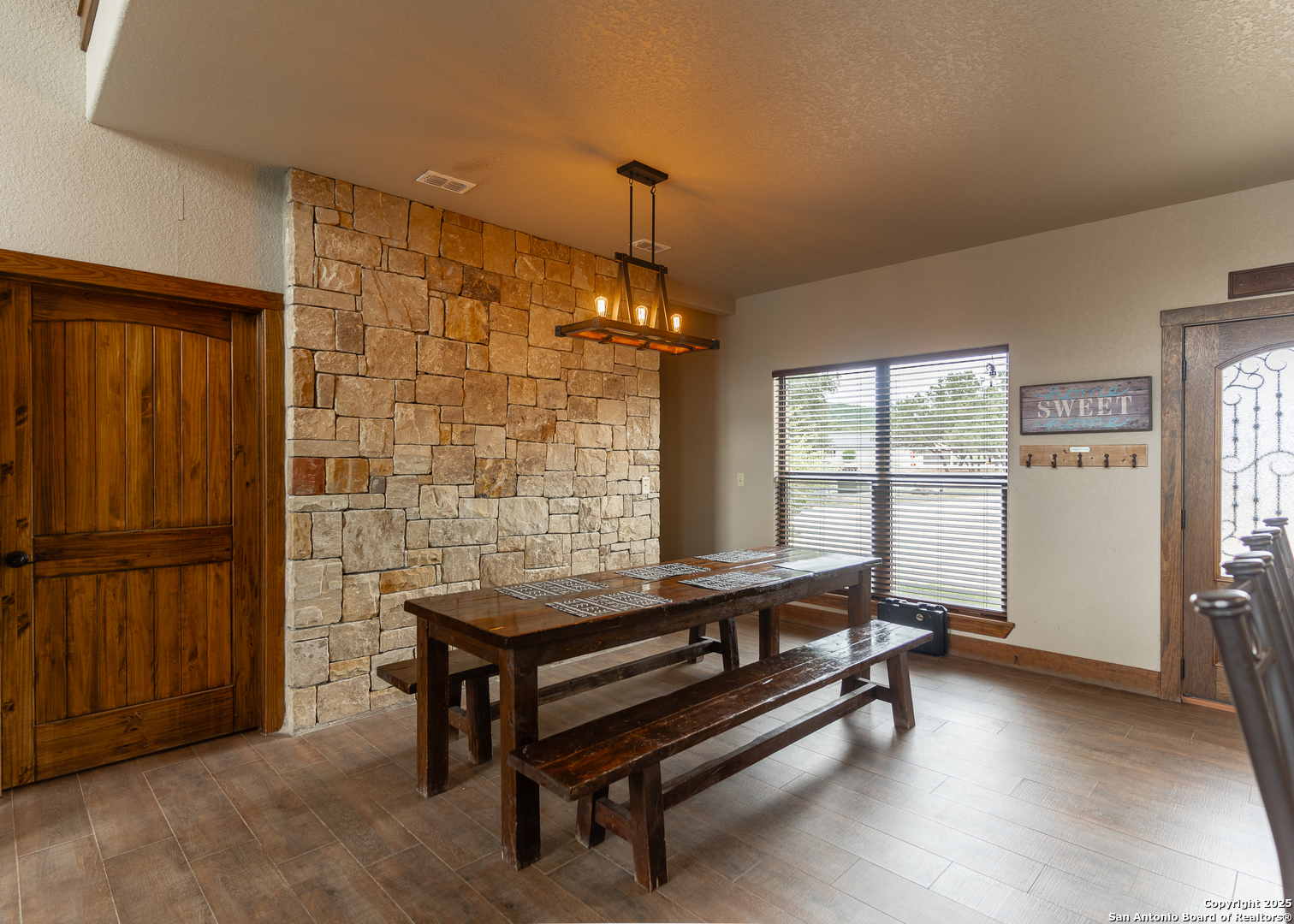 24 Morning Dew Concan, TX 78838 - Photo 17 of 88 a living room with furniture a window and a chandelier
