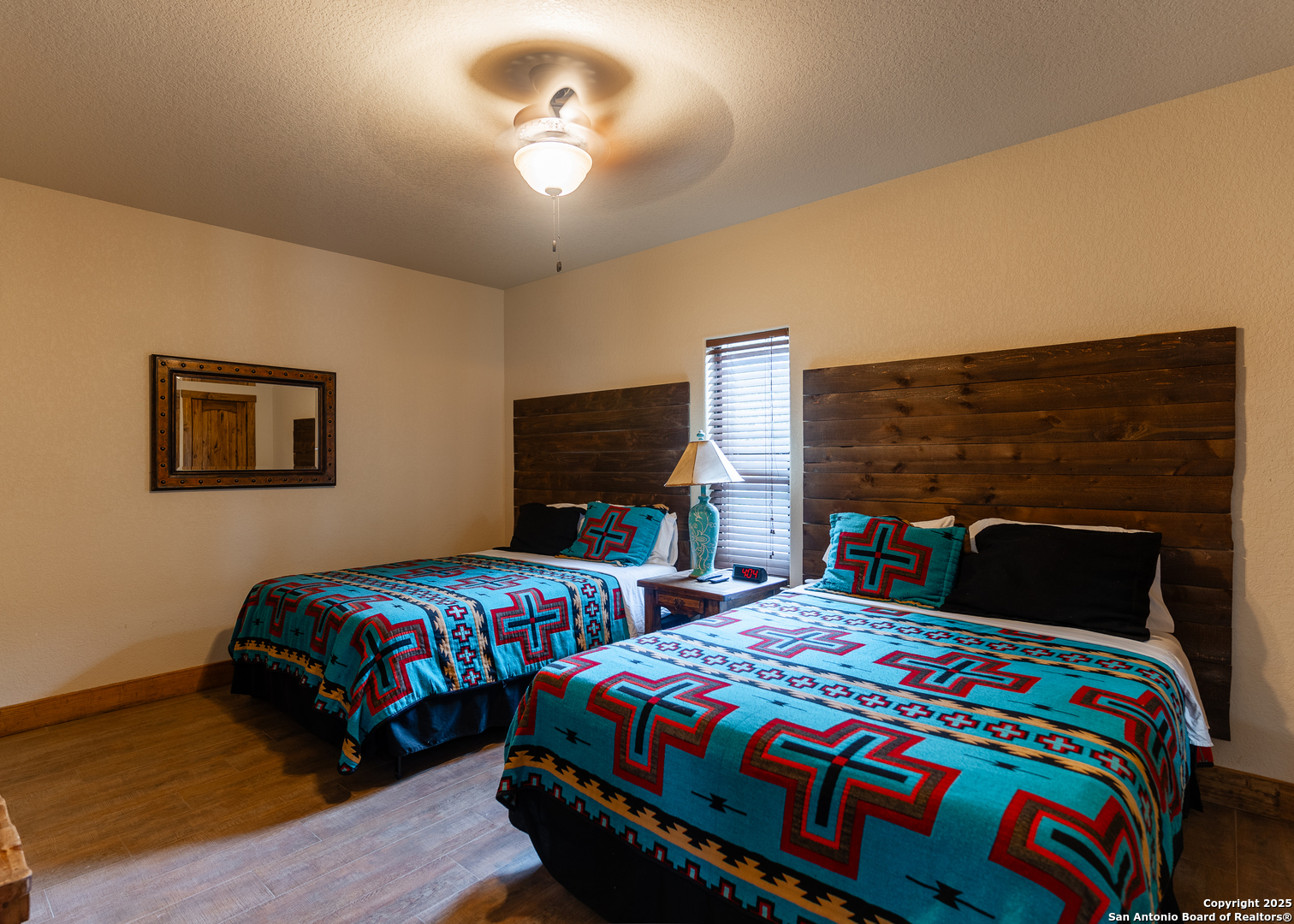 24 Morning Dew Concan, TX 78838 - Photo 26 of 88 a bedroom with two beds and a lamp