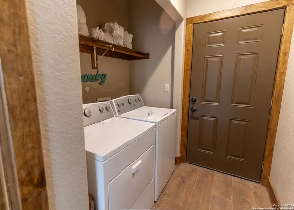 a view of a dining table and chairs in the balcony