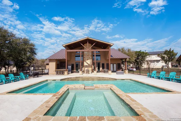 an aerial view of a house with garden space and street view