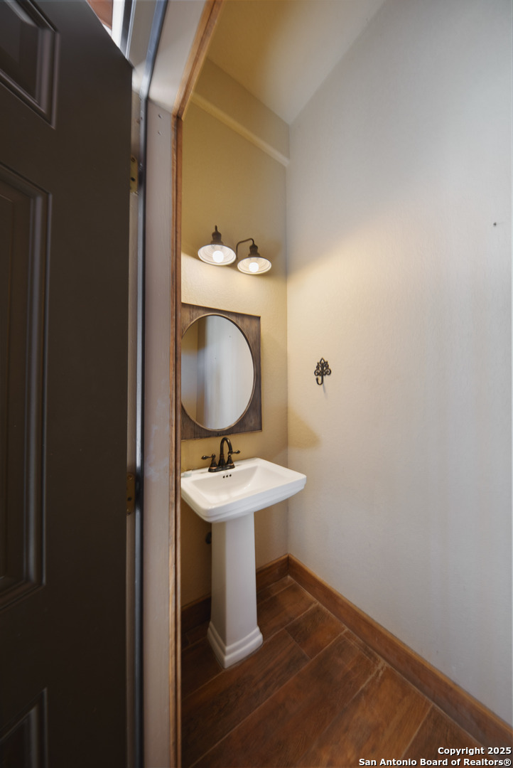 24 Morning Dew Concan, TX 78838 - Photo 55 of 88 a bathroom with a toilet a sink and mirror