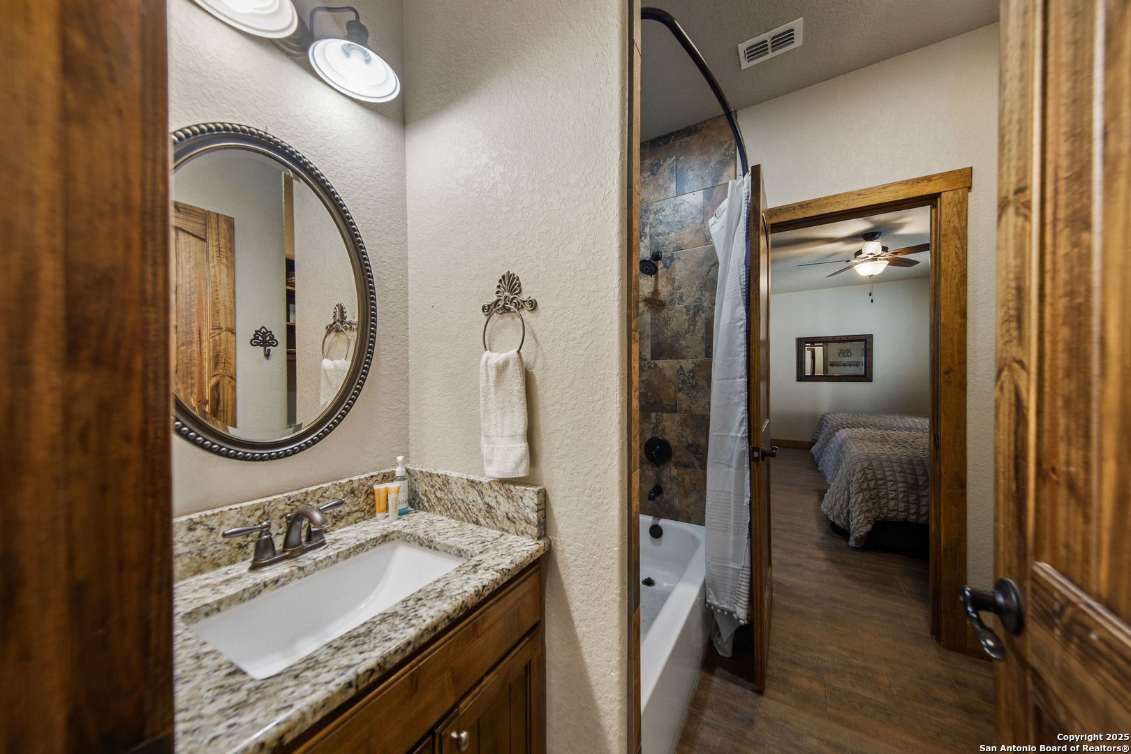 24 Morning Dew Concan, TX 78838 - Photo 62 of 88 a bathroom with a granite countertop sink vanity and mirror