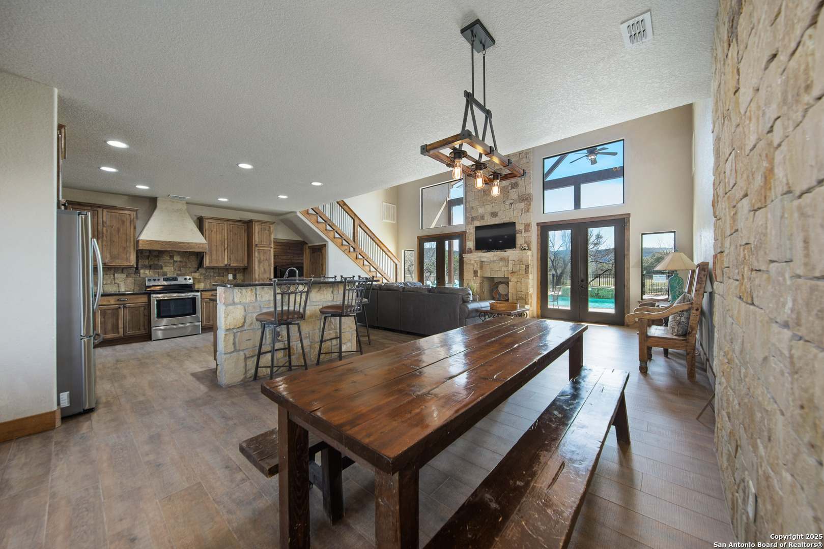 24 Morning Dew Concan, TX 78838 - Photo 63 of 88 a dining room with furniture a chandelier and wooden floor