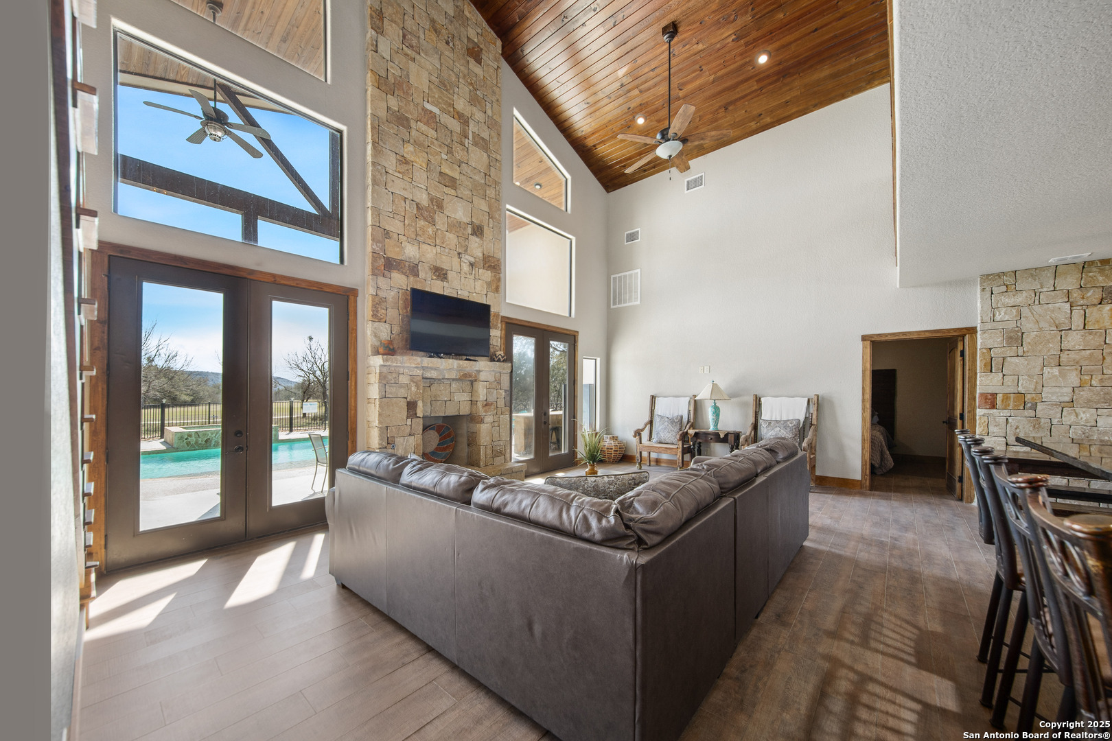 24 Morning Dew Concan, TX 78838 - Photo 76 of 88 a living room with fireplace furniture and a floor to ceiling window