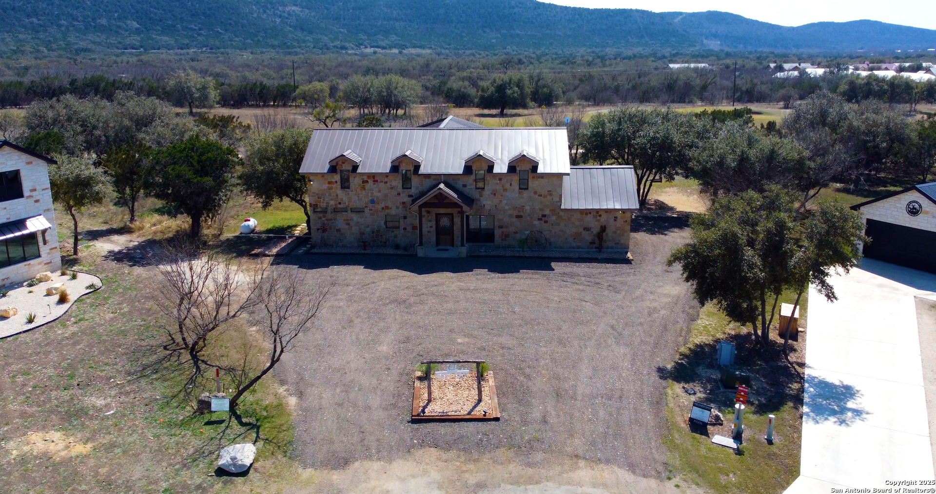 24 Morning Dew Concan, TX 78838 - Photo 9 of 88 an aerial view of a house with yard and mountain view in back