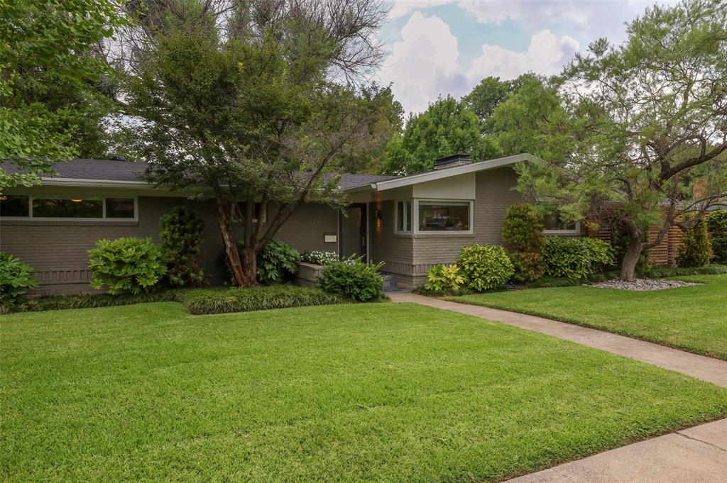 6631 Ridgemont Drive Dallas, TX 75214 - Photo 1 of 1 a front view of house with yard and green space