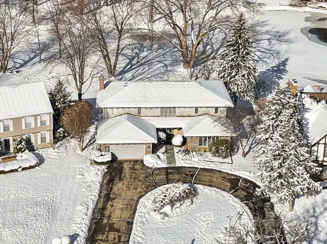 a view of a house with snow on the floor