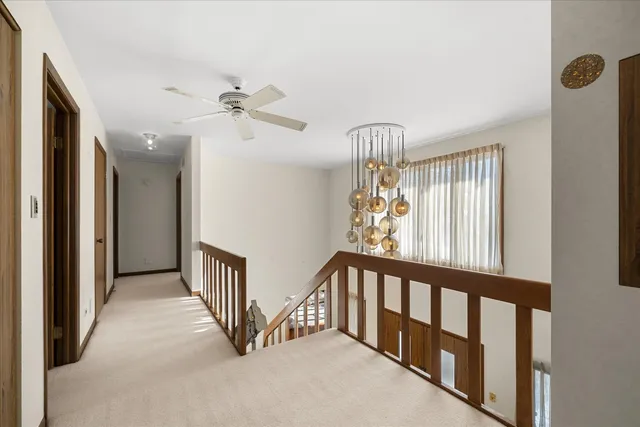 a view of a hallway with windows