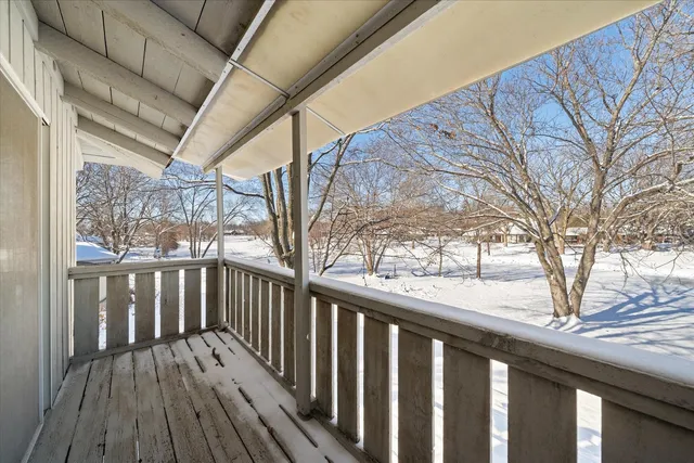 a view of a wooden deck with a trees