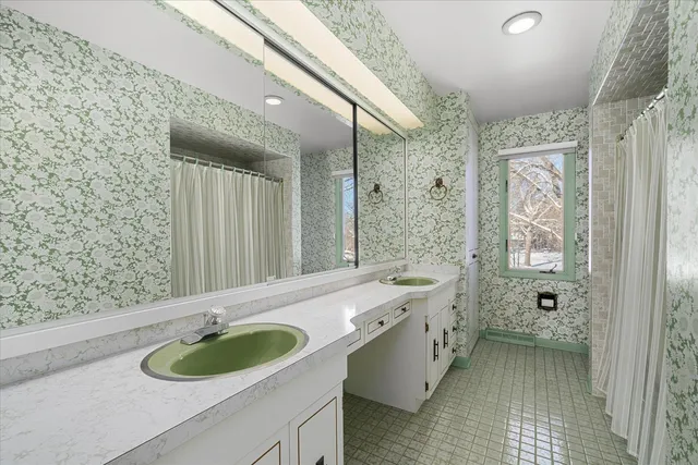 a bathroom with a sink and a mirror