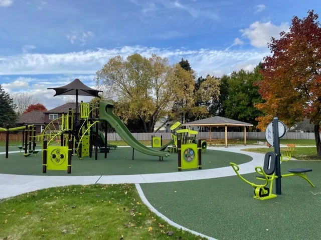 a view of tennis court with trees in the background
