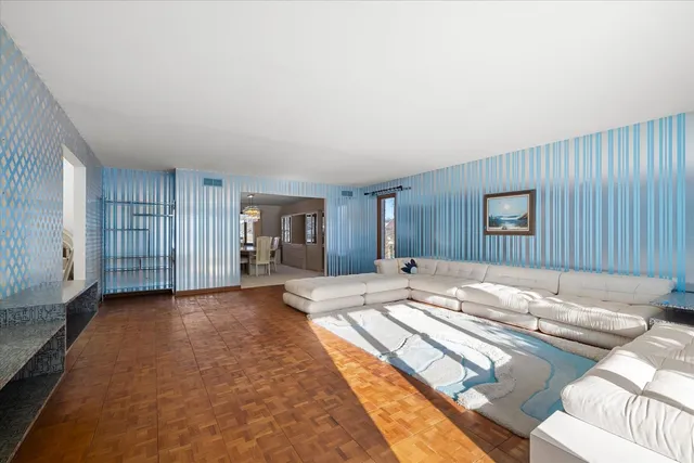 a spacious bedroom with a bed and a couch