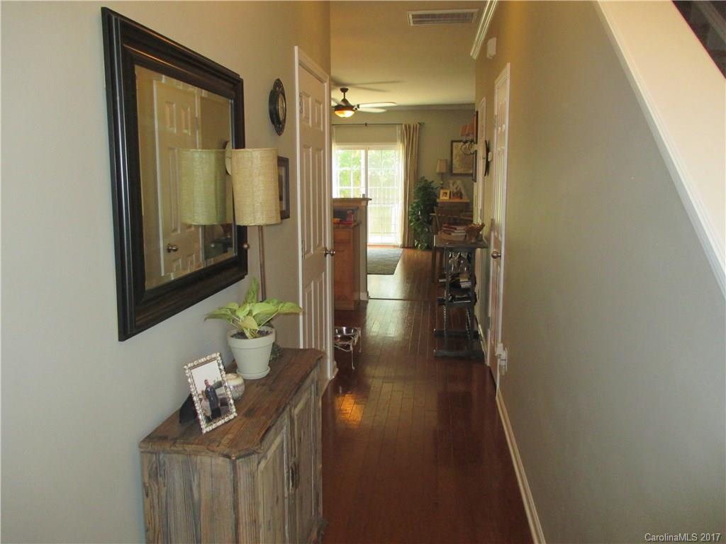 2147 Midnight Blue Lane, Unit 181 Fort Mill, SC 29708 - Photo 2 of 21 a hallway with sliding door and wooden floor