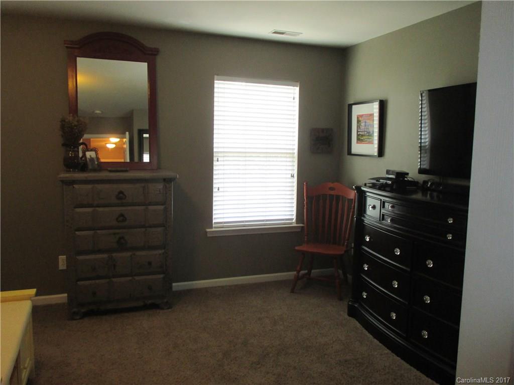 2147 Midnight Blue Lane, Unit 181 Fort Mill, SC 29708 - Photo 12 of 21 a room that has a dresser in it