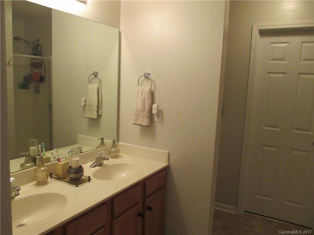 2147 Midnight Blue Lane, Unit 181 Fort Mill, SC 29708 - Photo 13 of 21 a bathroom with a sink and a mirror