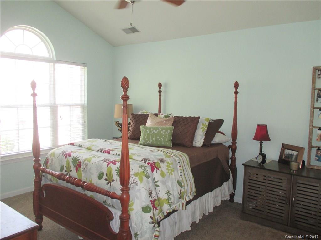 2147 Midnight Blue Lane, Unit 181 Fort Mill, SC 29708 - Photo 15 of 21 a bedroom with bed and window