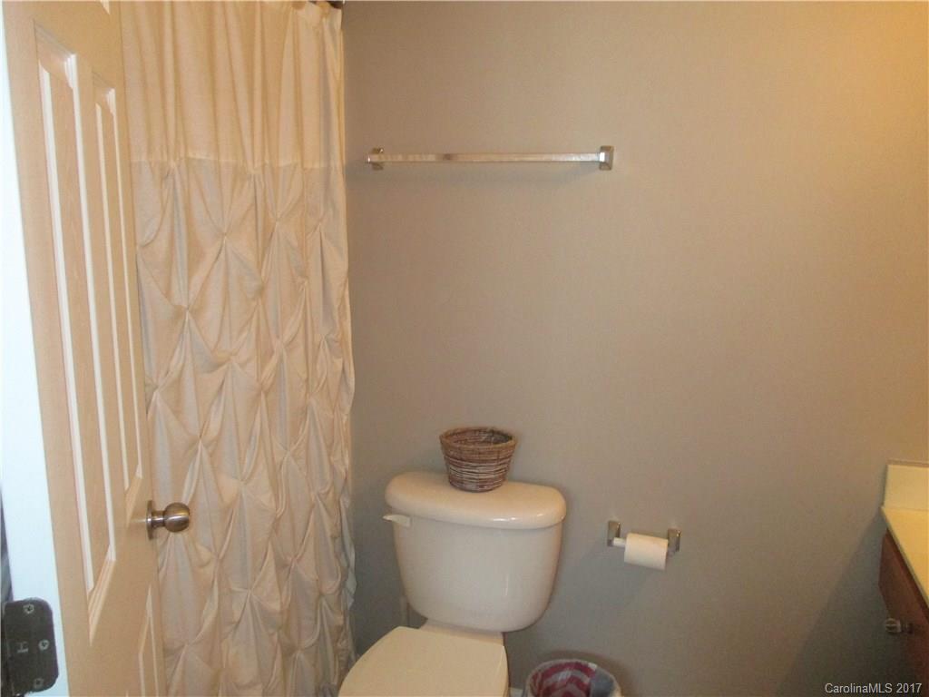 2147 Midnight Blue Lane, Unit 181 Fort Mill, SC 29708 - Photo 16 of 21 a bathroom with a toilet and a shower curtain