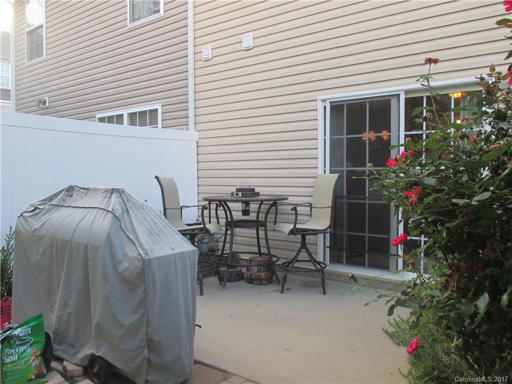 2147 Midnight Blue Lane, Unit 181 Fort Mill, SC 29708 - Photo 19 of 21 a view of backyard with seating space and potted plants