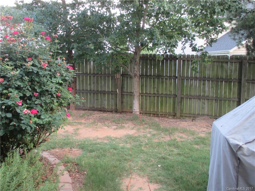 2147 Midnight Blue Lane, Unit 181 Fort Mill, SC 29708 - Photo 21 of 21 a view of backyard with wooden fence