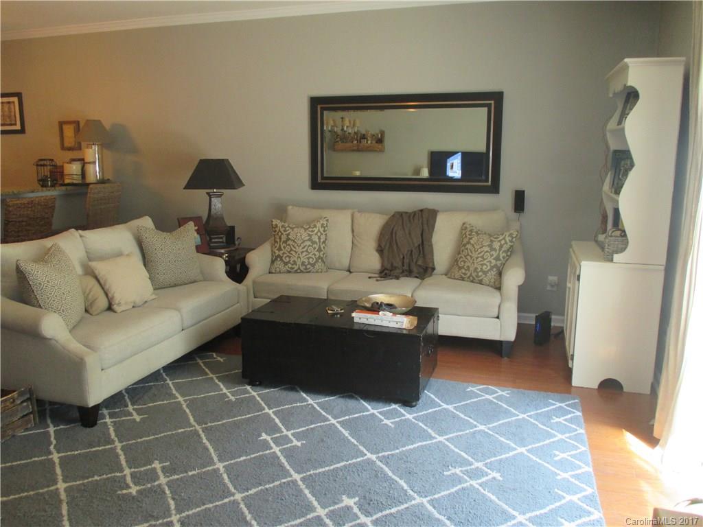 2147 Midnight Blue Lane, Unit 181 Fort Mill, SC 29708 - Photo 6 of 21 a living room with a couch and a rug
