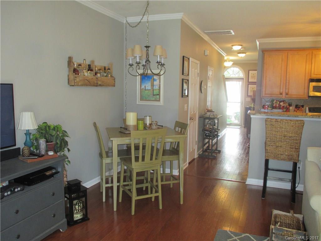 2147 Midnight Blue Lane, Unit 181 Fort Mill, SC 29708 - Photo 7 of 21 a dining room with furniture and wooden floor