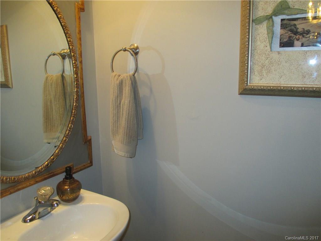 2147 Midnight Blue Lane, Unit 181 Fort Mill, SC 29708 - Photo 9 of 21 a bathroom with a sink and a mirror