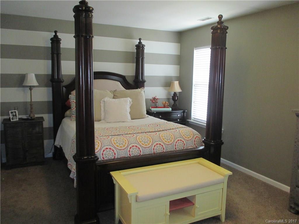 2147 Midnight Blue Lane, Unit 181 Fort Mill, SC 29708 - Photo 10 of 21 a bedroom with a bed and a table