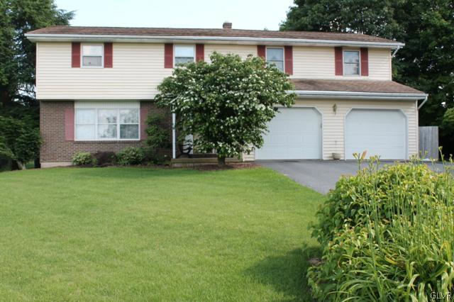 459 Nolf Road Nazareth, PA 18064 - Photo 1 of 23 a front view of a house with a yard and garage