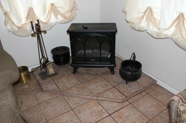 459 Nolf Road Nazareth, PA 18064 - Photo 11 of 23 a living room with furniture a flat screen a table and chairs
